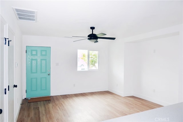 unfurnished room featuring light hardwood / wood-style flooring and ceiling fan