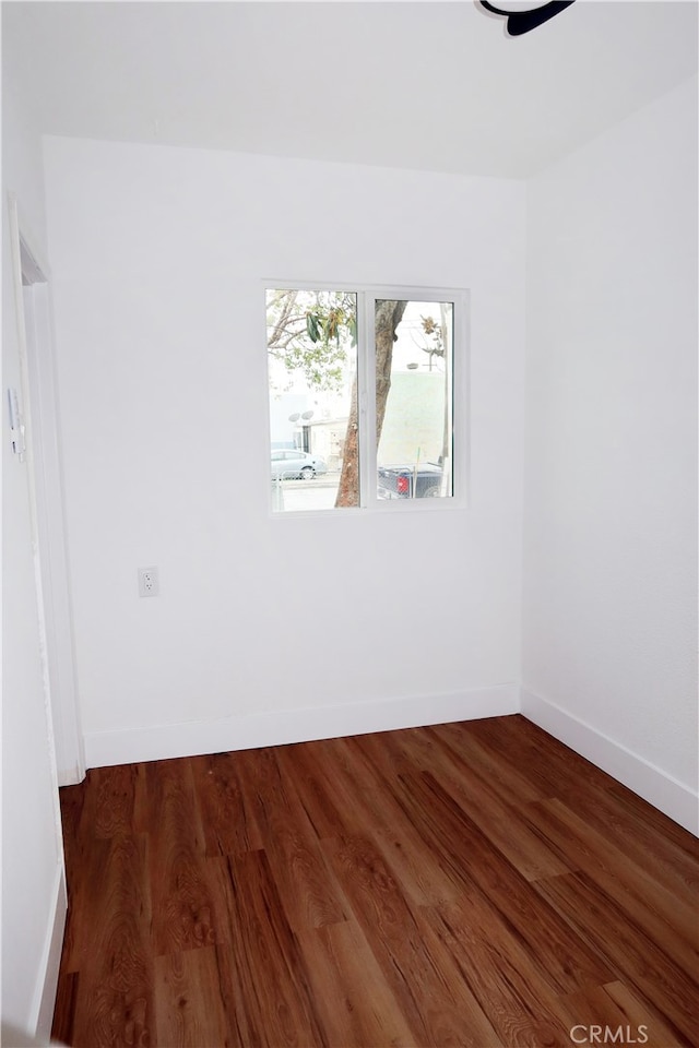 empty room featuring dark hardwood / wood-style floors