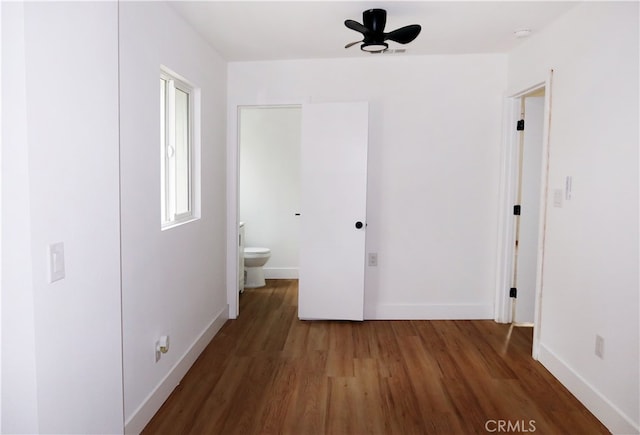 hallway with dark hardwood / wood-style floors