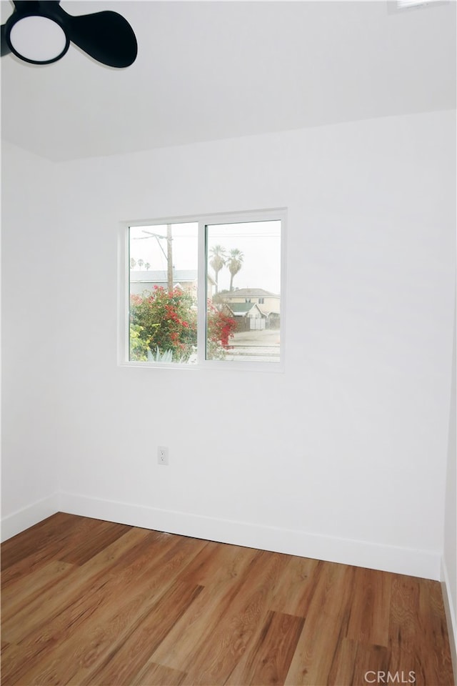 unfurnished room with hardwood / wood-style floors