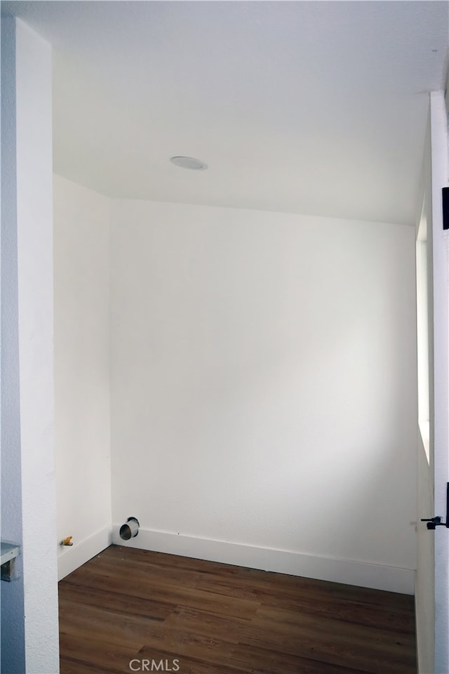 laundry room featuring dark wood-type flooring