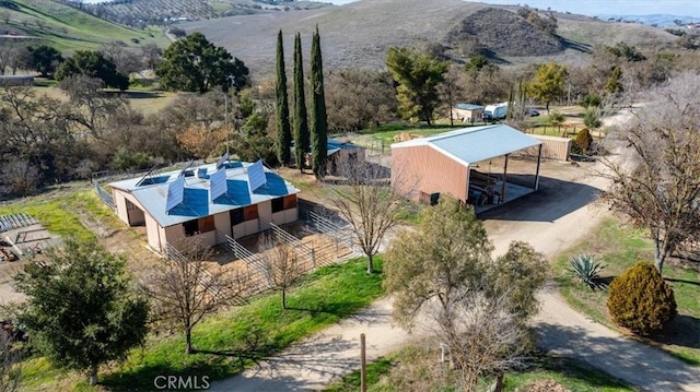 birds eye view of property with a mountain view