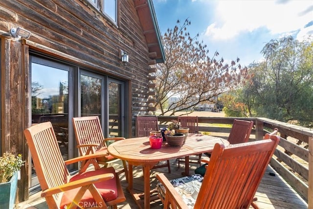 deck featuring outdoor dining space