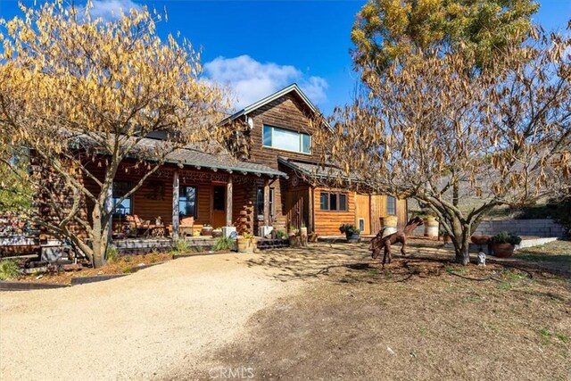 log home with covered porch