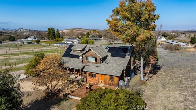 birds eye view of property with a rural view and a mountain view