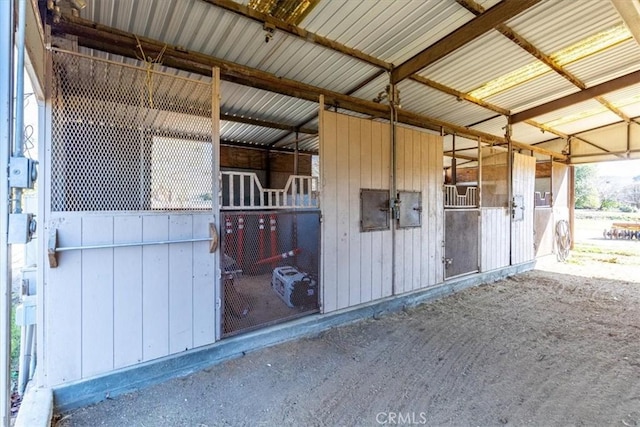 view of horse barn featuring electric panel