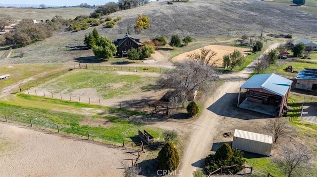 birds eye view of property with a rural view