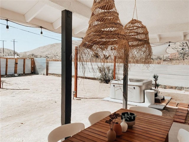 snow covered patio with a mountain view