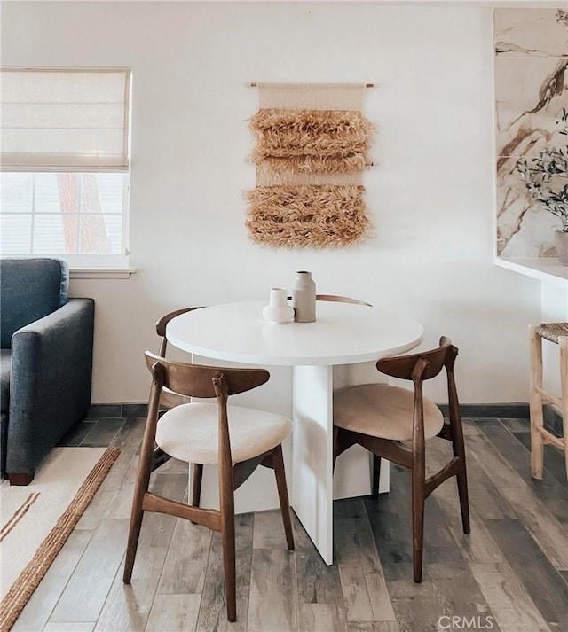 dining area featuring hardwood / wood-style floors