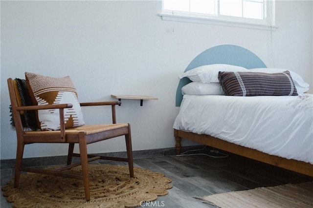 bedroom with hardwood / wood-style flooring