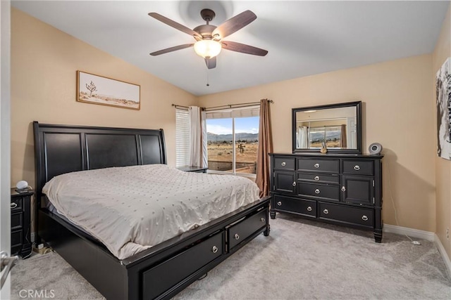 bedroom with light carpet, lofted ceiling, and ceiling fan