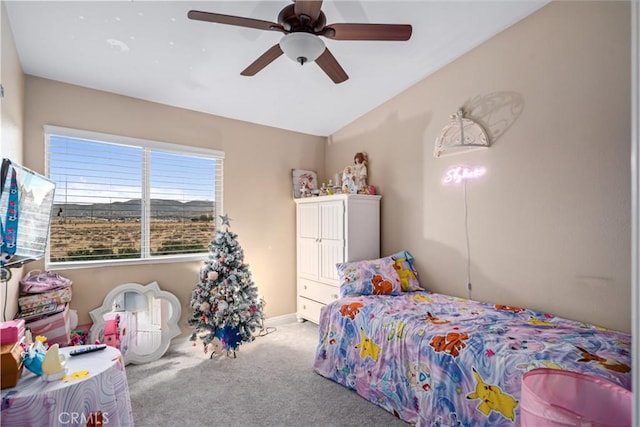 carpeted bedroom with ceiling fan and lofted ceiling