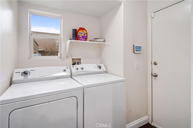 washroom with independent washer and dryer