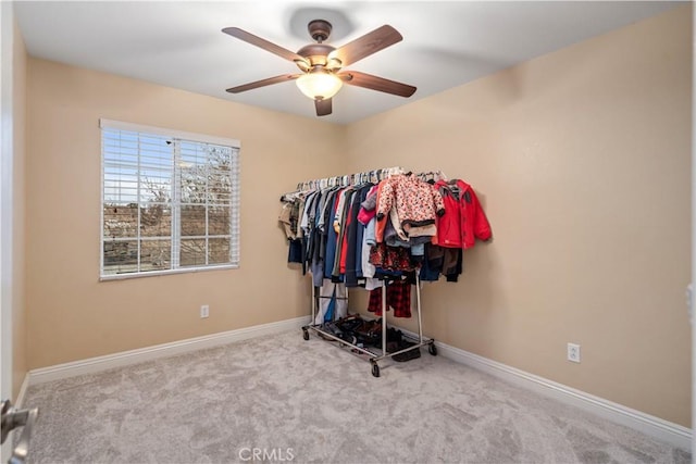 interior space featuring light colored carpet and ceiling fan