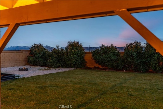 yard at dusk with a mountain view