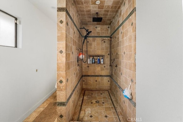 bathroom featuring tiled shower