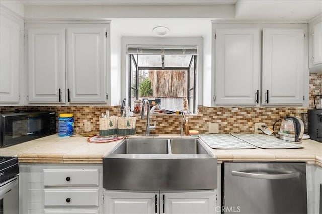 kitchen with white cabinetry and sink