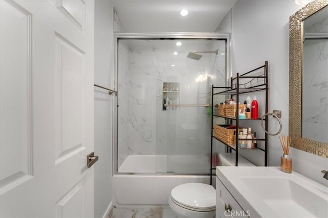 full bathroom with vanity, combined bath / shower with glass door, and toilet