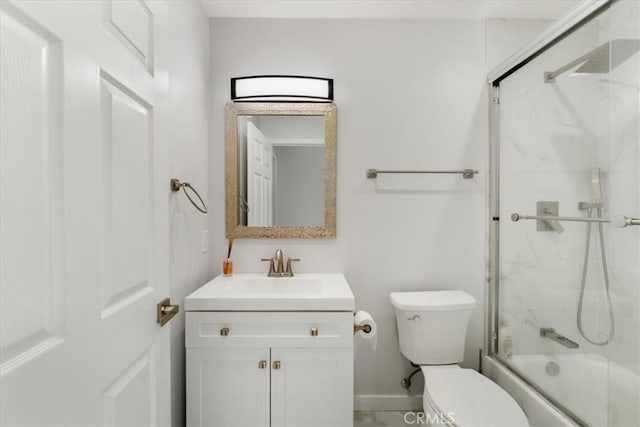 full bathroom with vanity, shower / bath combination with glass door, and toilet