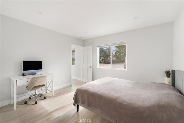 bedroom with light hardwood / wood-style floors