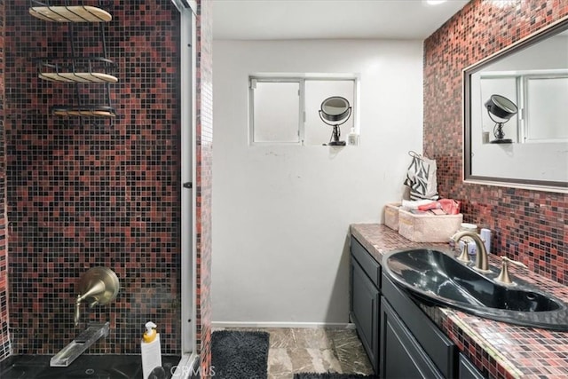 bathroom with tasteful backsplash, vanity, and a tile shower