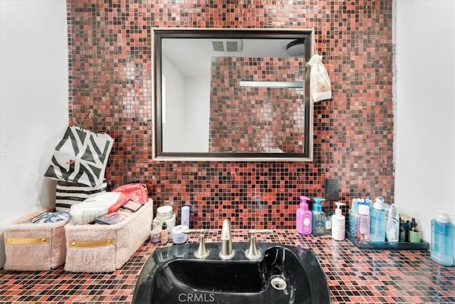 interior space with sink and decorative backsplash