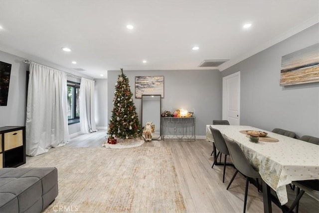 dining space featuring light wood-type flooring