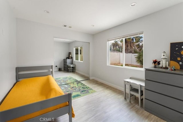 bedroom with light hardwood / wood-style floors