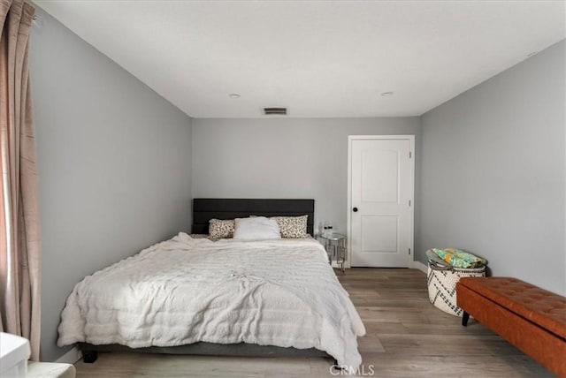 bedroom featuring wood-type flooring