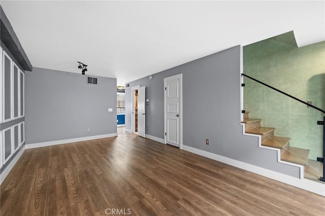 unfurnished living room with hardwood / wood-style flooring