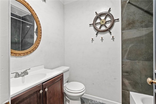 full bathroom with tiled shower / bath, vanity, and toilet