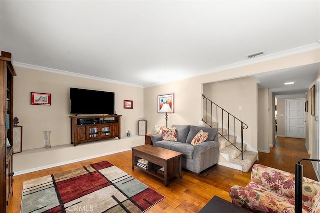 living room featuring crown molding and light wood-type flooring