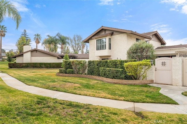 view of side of property featuring a lawn