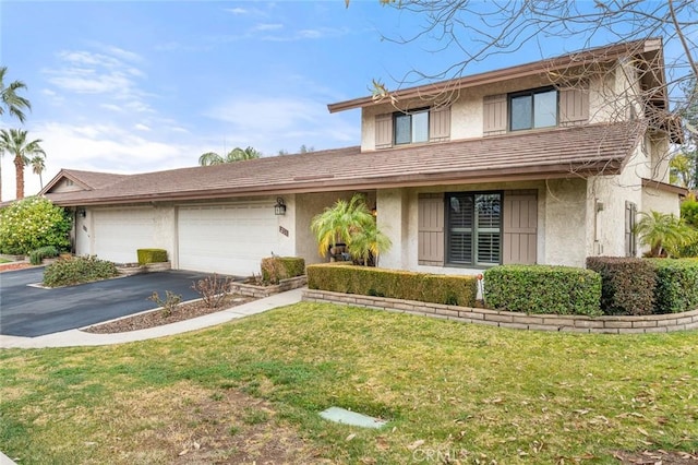 front facade with a garage and a front yard