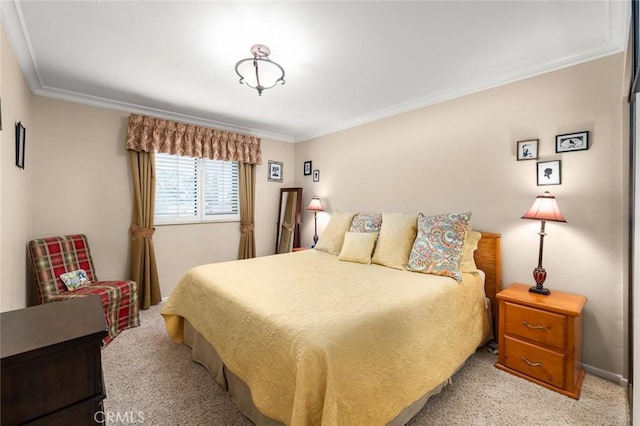 carpeted bedroom featuring crown molding