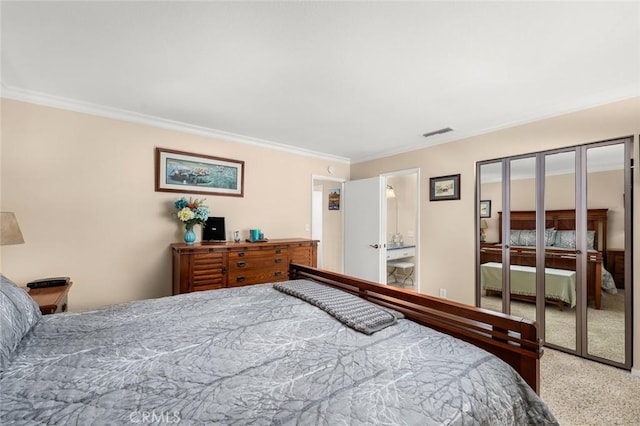 bedroom featuring french doors, crown molding, and carpet