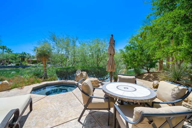 view of swimming pool with an in ground hot tub and a patio area