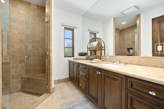 bathroom featuring tasteful backsplash, vanity, an enclosed shower, and tile patterned flooring