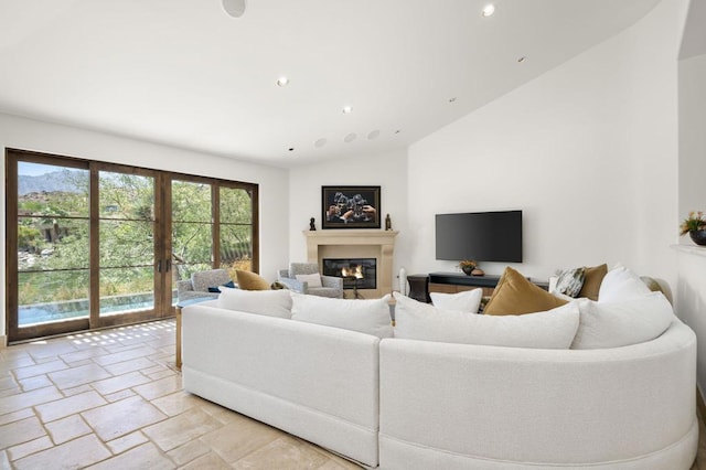 living room featuring french doors and lofted ceiling