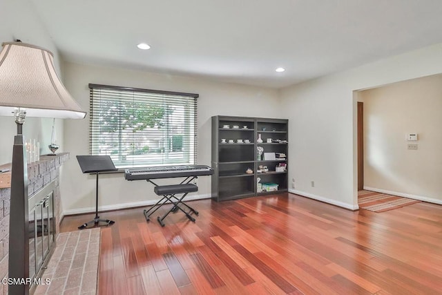 home office with wood-type flooring