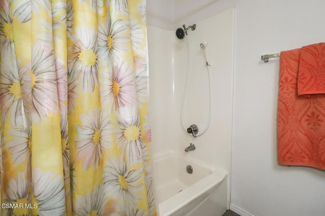 bathroom featuring shower / bath combination with curtain