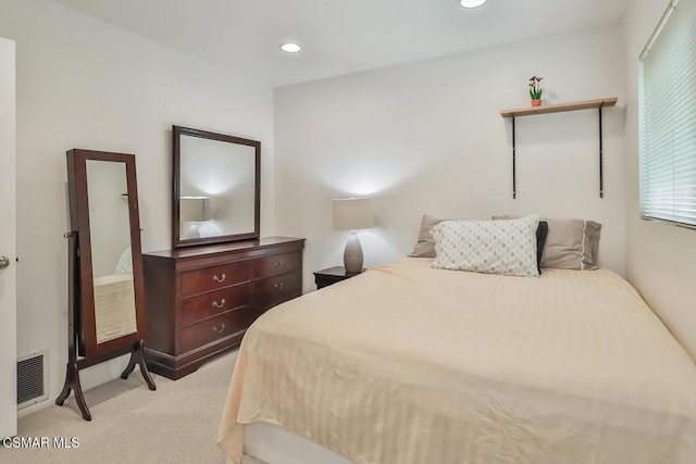 bedroom featuring light colored carpet