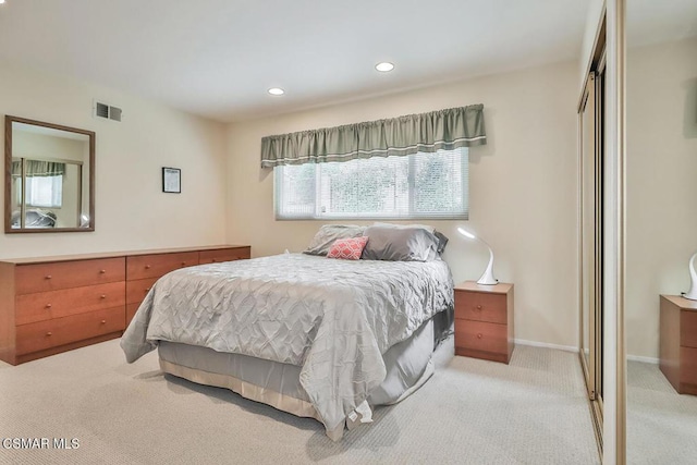 carpeted bedroom featuring a closet