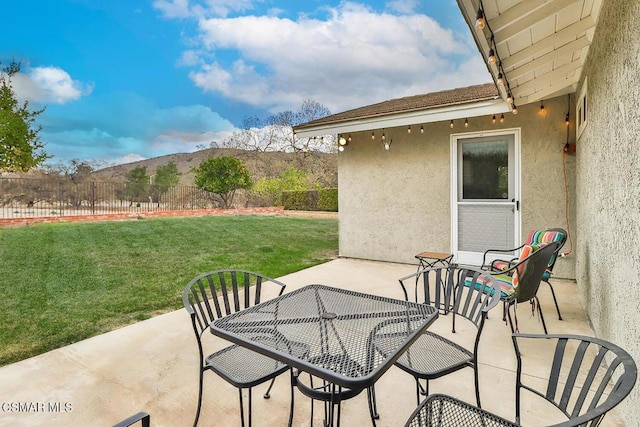 view of patio / terrace with a mountain view