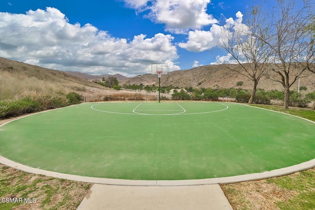 view of basketball court featuring a mountain view