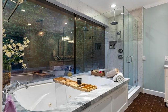 bathroom with separate shower and tub