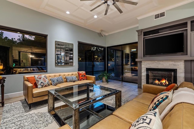 living room with crown molding, ceiling fan, and hardwood / wood-style floors