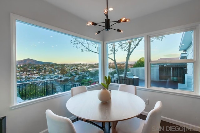 sunroom featuring a chandelier