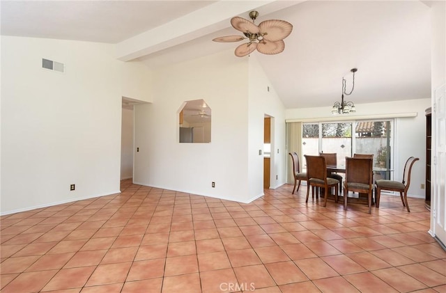 interior space with high vaulted ceiling and ceiling fan with notable chandelier