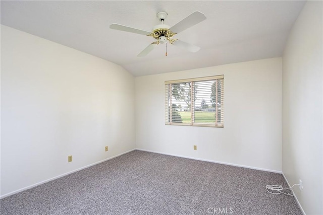 carpeted empty room featuring ceiling fan and lofted ceiling